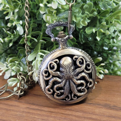 Mini Metallwürfel mit Aufbewahrung im Taschenuhrformat: Brass Kraken